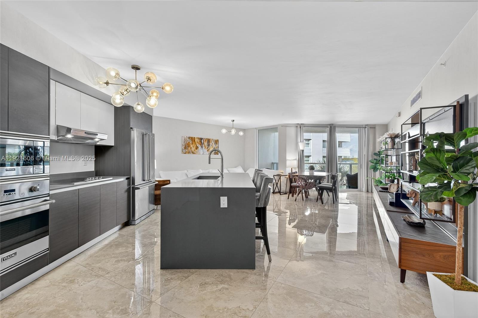 9821 East Bay Harbor Drive, Unit 402 Bay Harbor Islands, FL 33154 - Photo 3 of 34 a view of a living room and kitchen area
