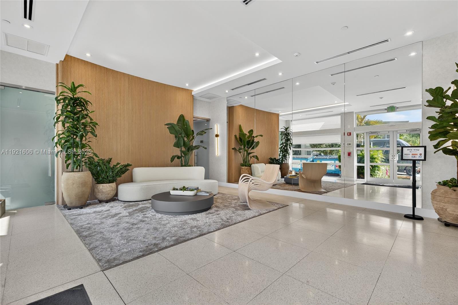 9821 East Bay Harbor Drive, Unit 402 Bay Harbor Islands, FL 33154 - Photo 32 of 34 a living room with furniture and a potted plant