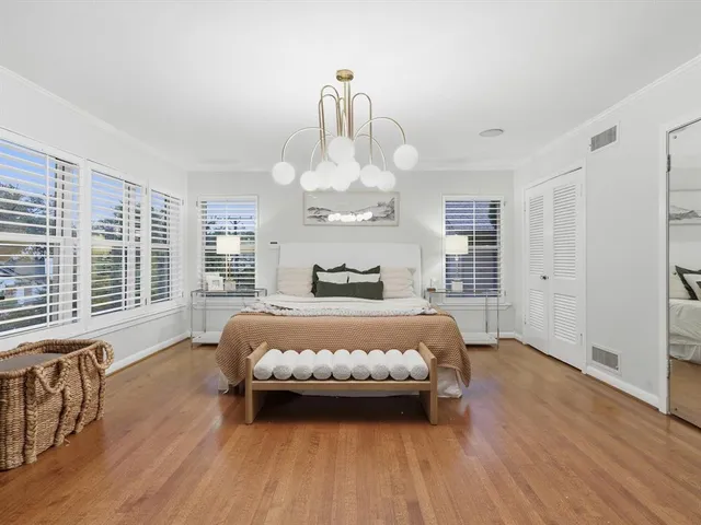 a bedroom with bed and window