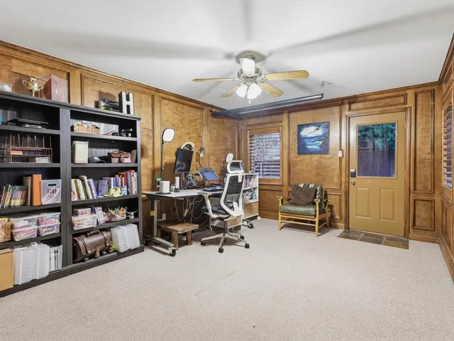 a view of a workspace with furniture