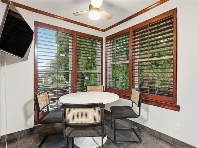 a view of a dining room with furniture window and outside view