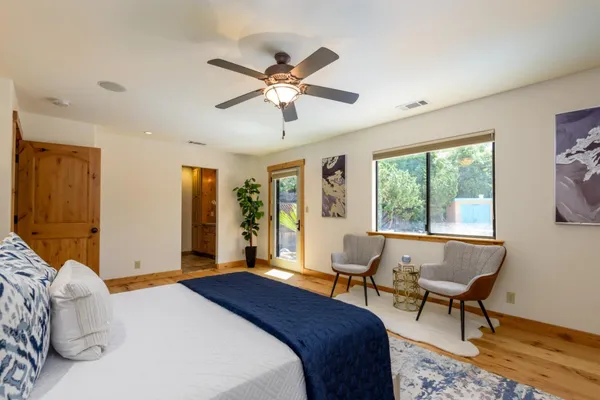 a bedroom with a bed and a window