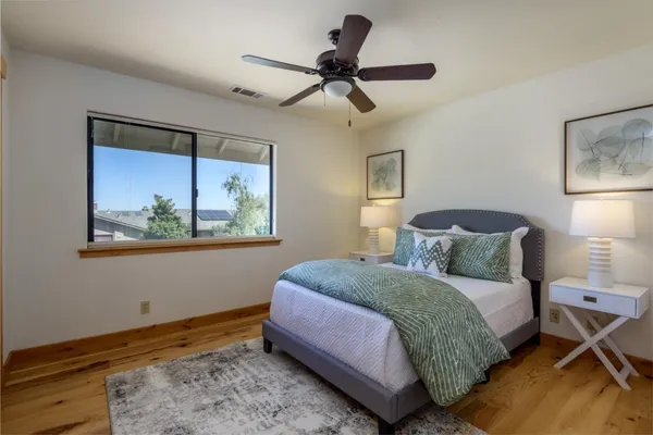 a bedroom with a bed and window