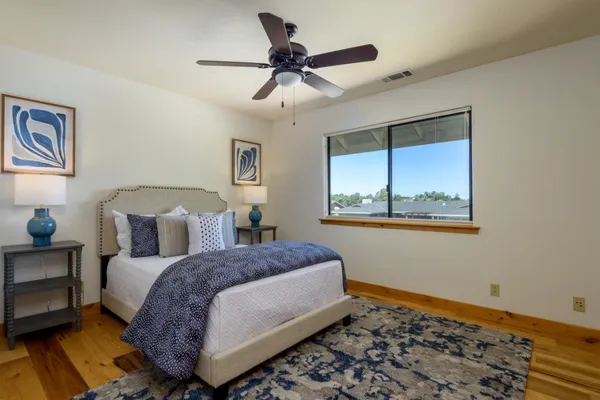 a bedroom with a bed and a window