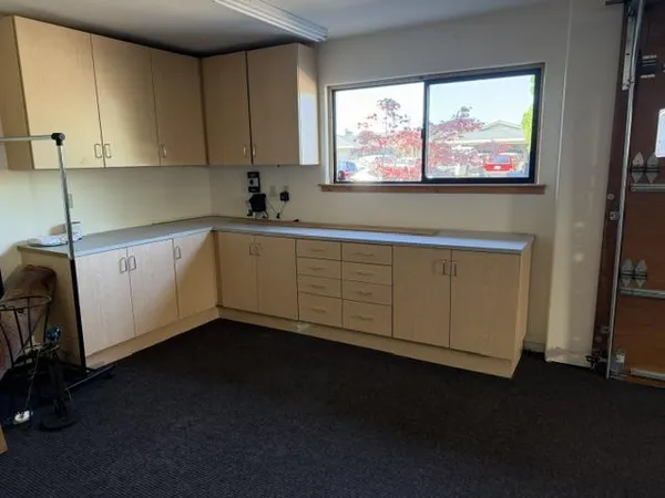 a view of a kitchen with furniture and window