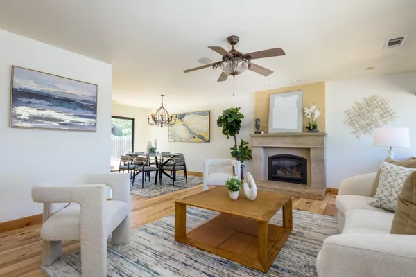 a living room with furniture and a fireplace