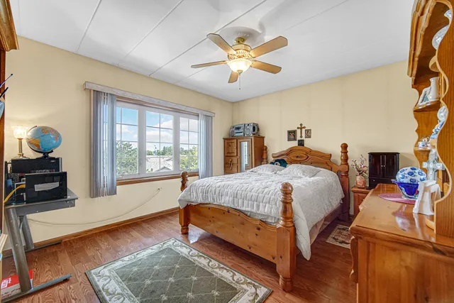 a bed room with a bed and a chandelier