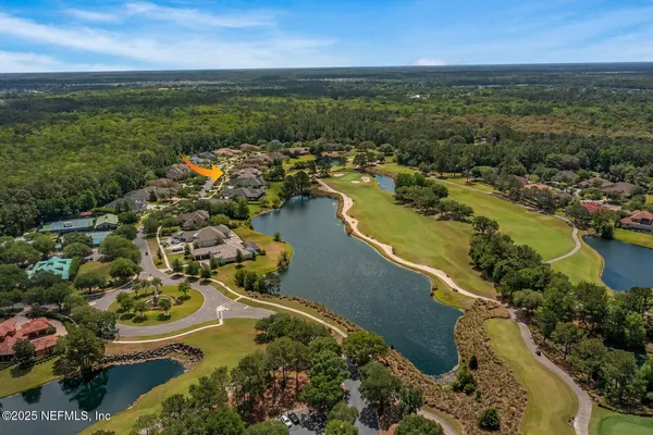 a kitchen with kitchen island granite countertop a sink and a stove top oven