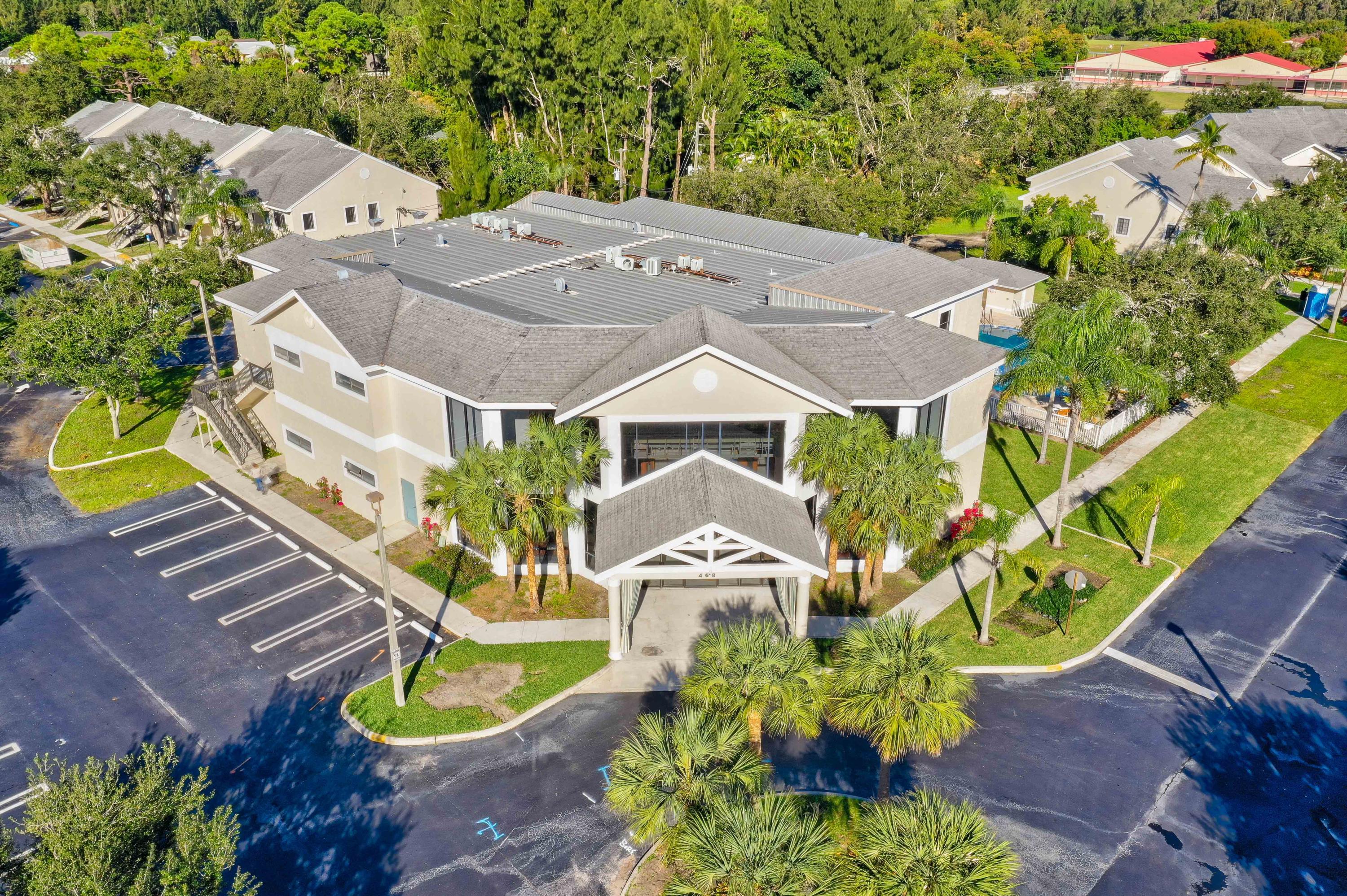 4685 Haverhill Road, Unit A11 West Palm Beach, FL 33417 - Photo 29 of 36 an aerial view of a house with a yard and garden
