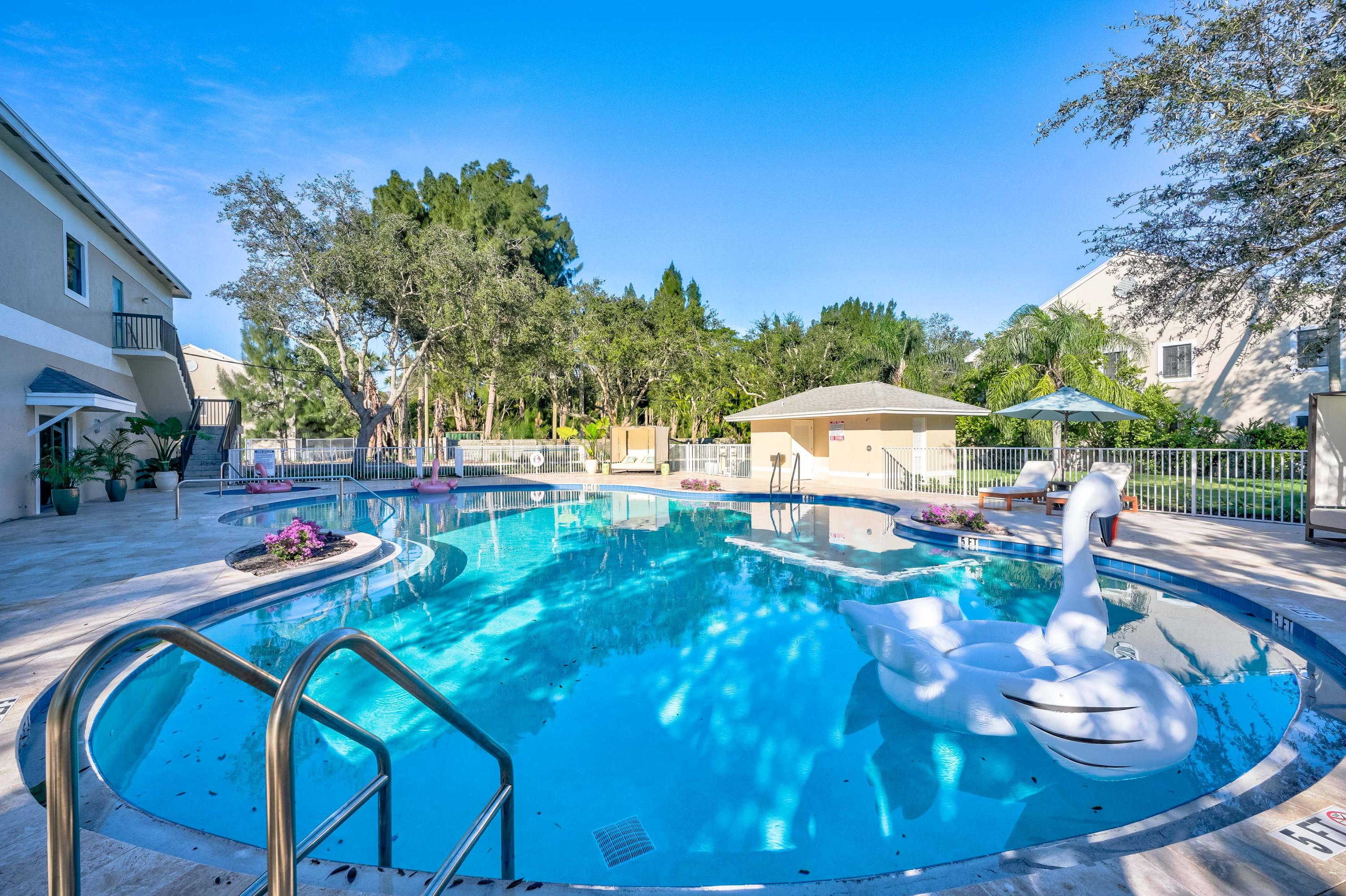 4685 Haverhill Road, Unit A11 West Palm Beach, FL 33417 - Photo 33 of 36 a view of a swimming pool with a patio