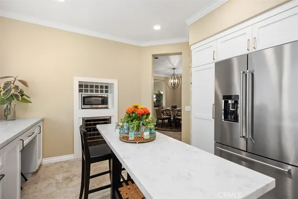 a kitchen with a refrigerator and stove
