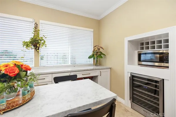 a kitchen that has a stove and a chair