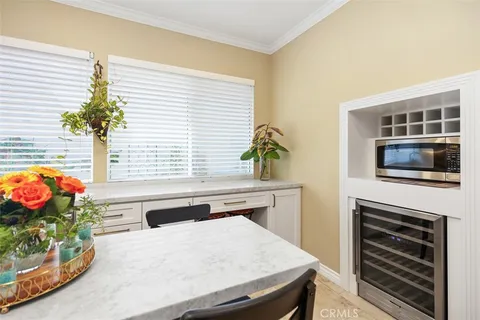a kitchen that has a stove and a chair