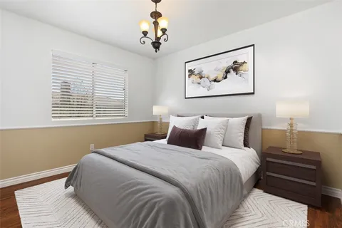a bedroom with bed and a window