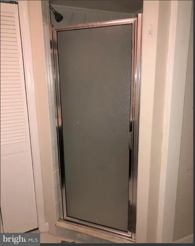 a bathroom with a glass door