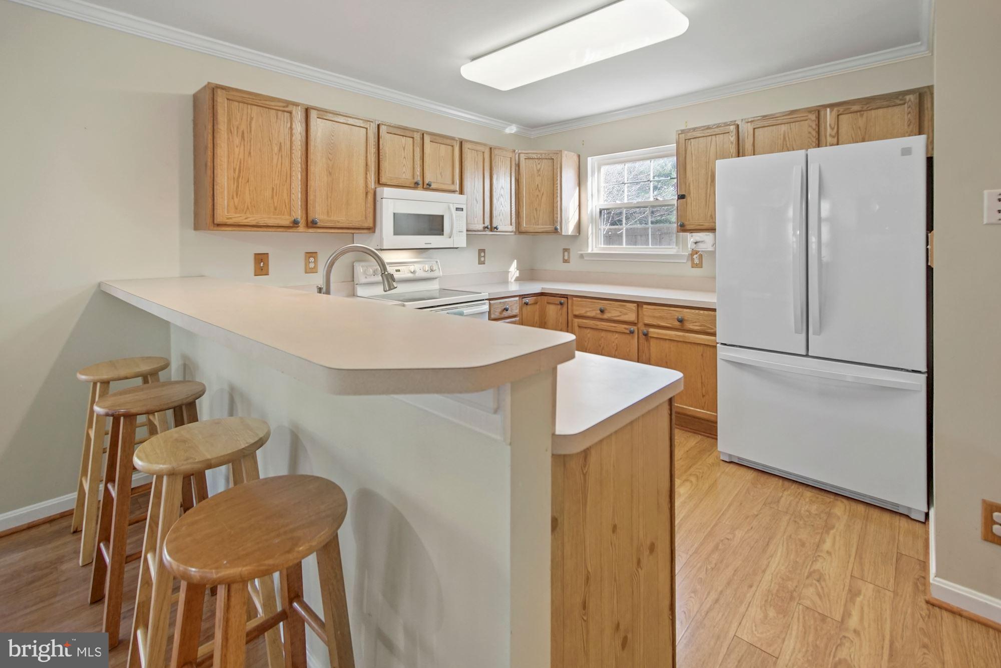 1731 Lottie Fowler Road Prince Frederick, MD 20678 - Photo 11 of 41 Kitchen with eat-in bar overhang