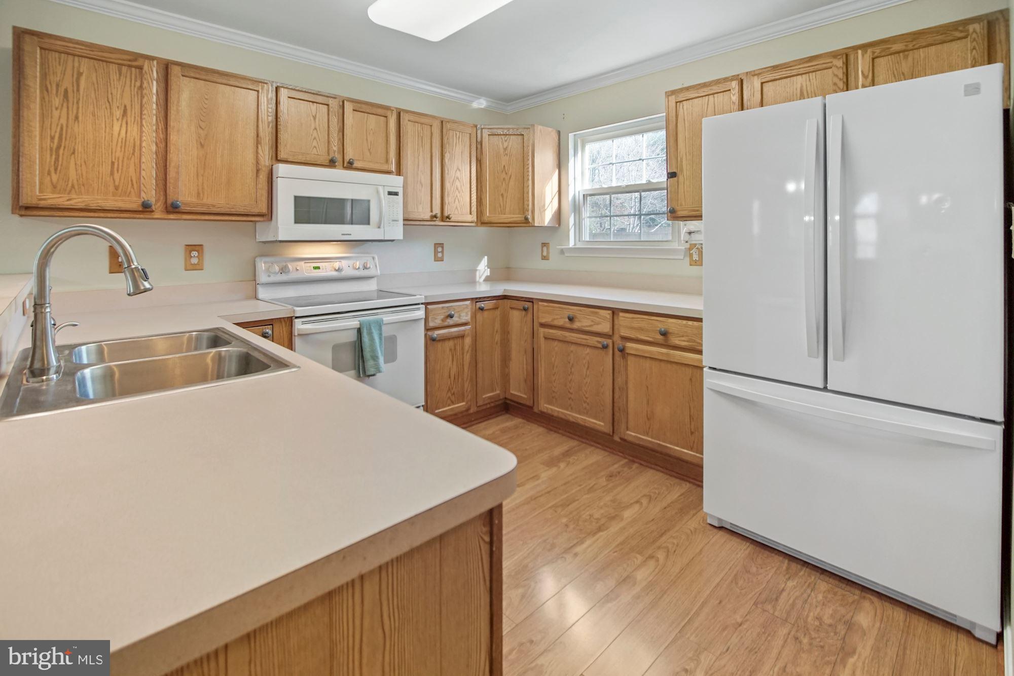 1731 Lottie Fowler Road Prince Frederick, MD 20678 - Photo 13 of 41 Kitchen set up w/ large fridge & natural daylight
