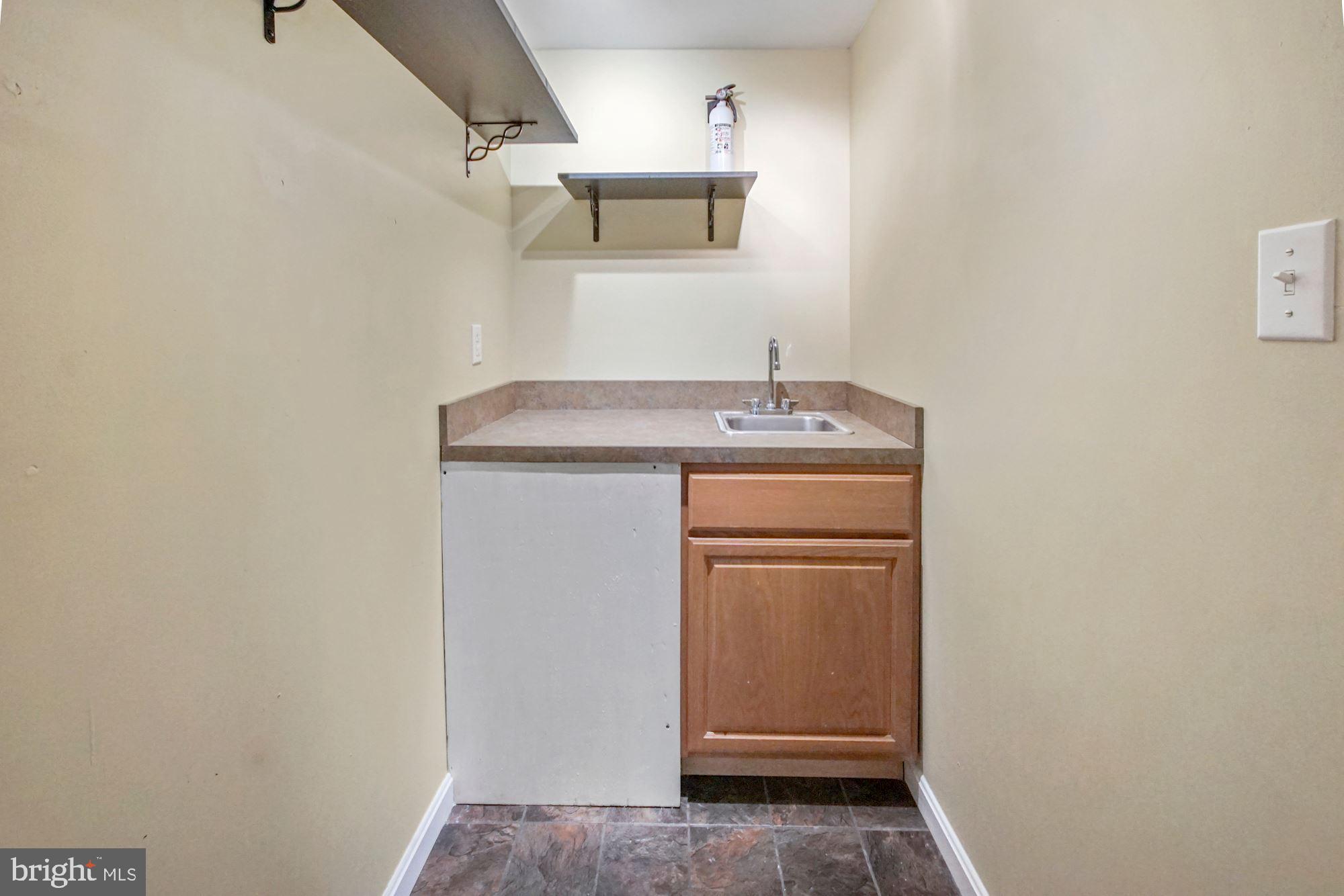 1731 Lottie Fowler Road Prince Frederick, MD 20678 - Photo 26 of 41 Wet bar off of rec room in basement