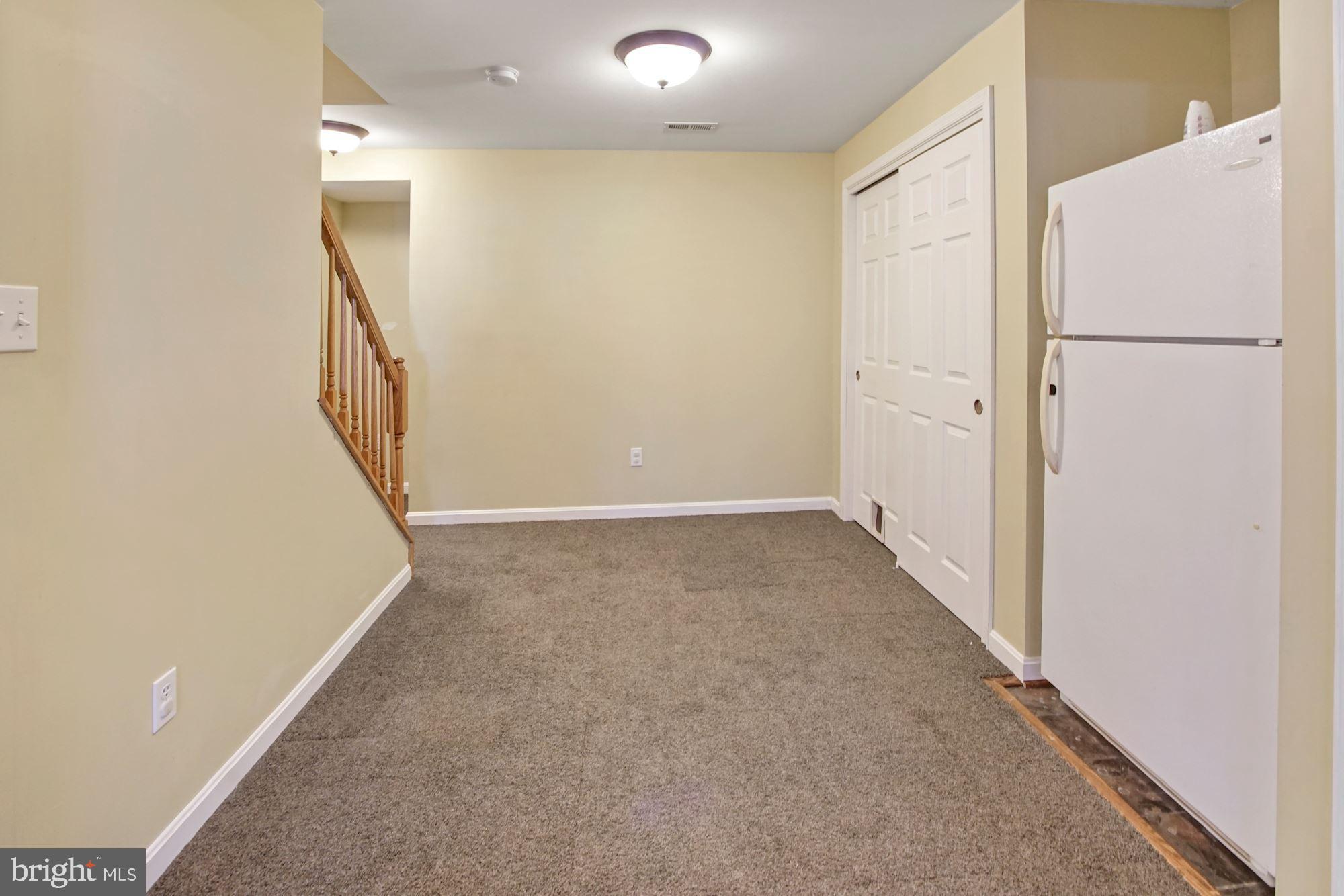 1731 Lottie Fowler Road Prince Frederick, MD 20678 - Photo 35 of 41 Basement with fridge and storage space