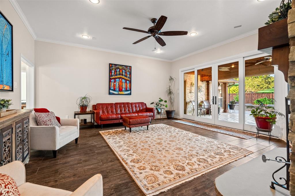 400 Hunters Ridge Circle Coppell, TX 75019 - Photo 12 of 35 a living room with couch and a large window