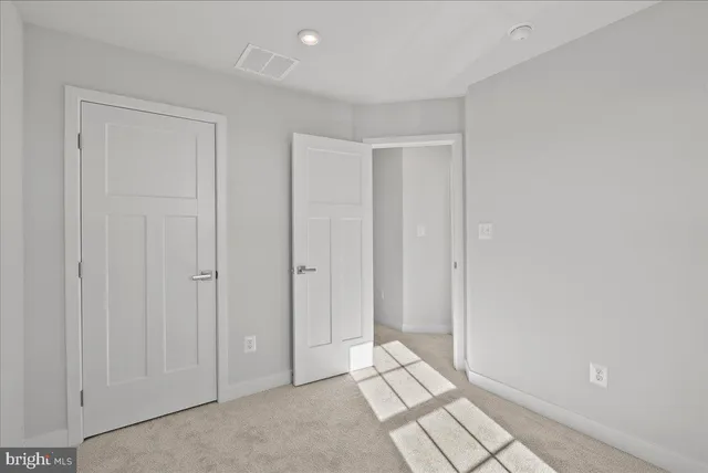 a view of a brick house with large windows