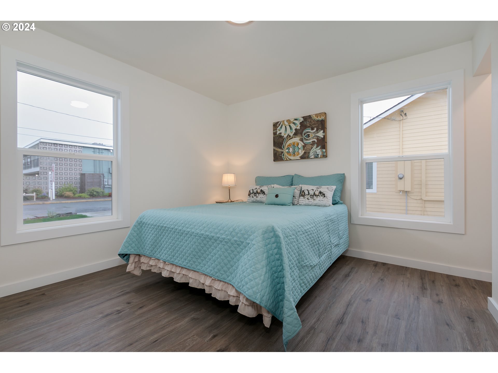 144 South 15th Street Springfield, OR 97477 - Photo 15 of 35 a bedroom with a bed and a window