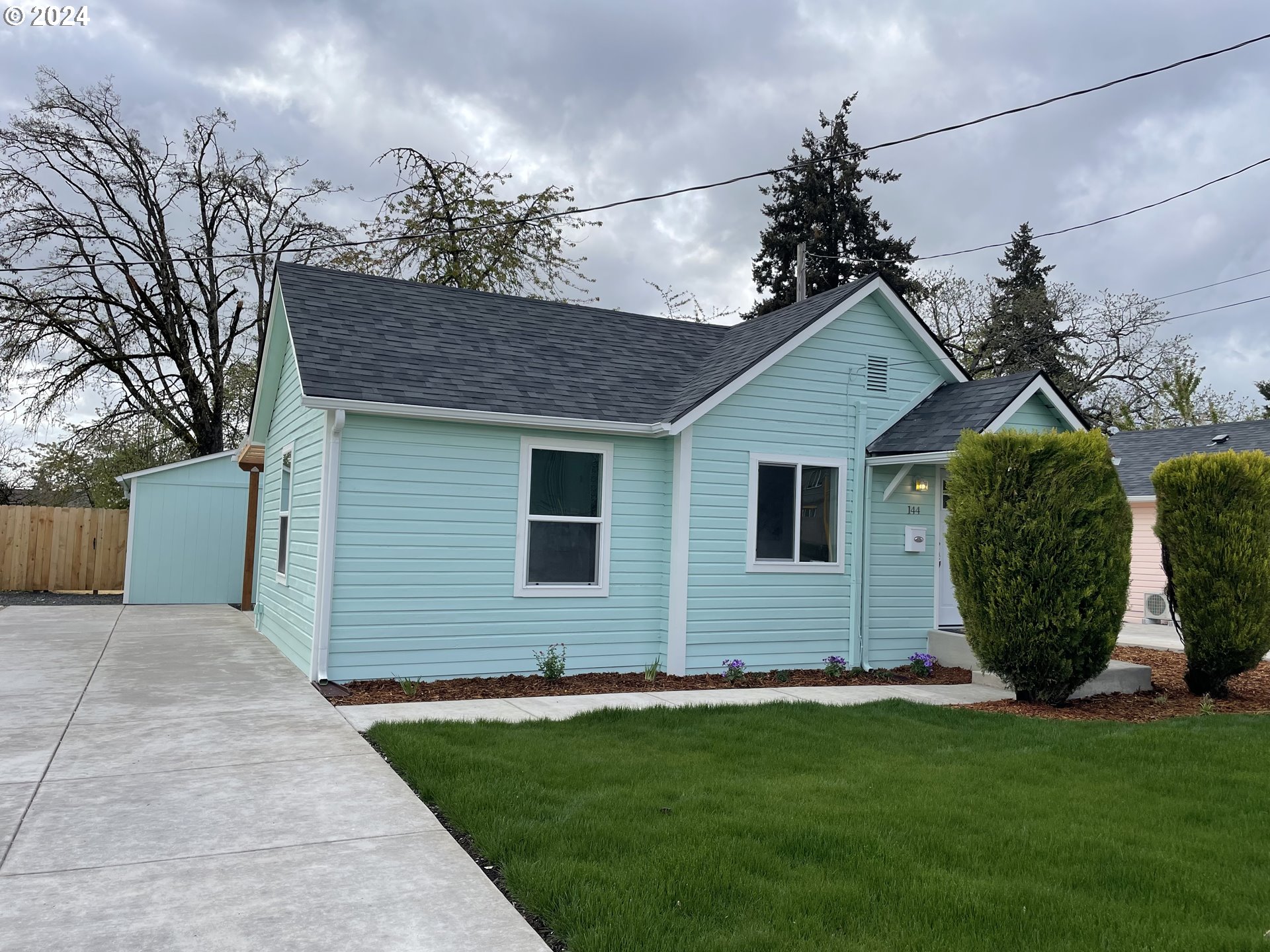 144 South 15th Street Springfield, OR 97477 - Photo 2 of 35 a view of a house with a backyard