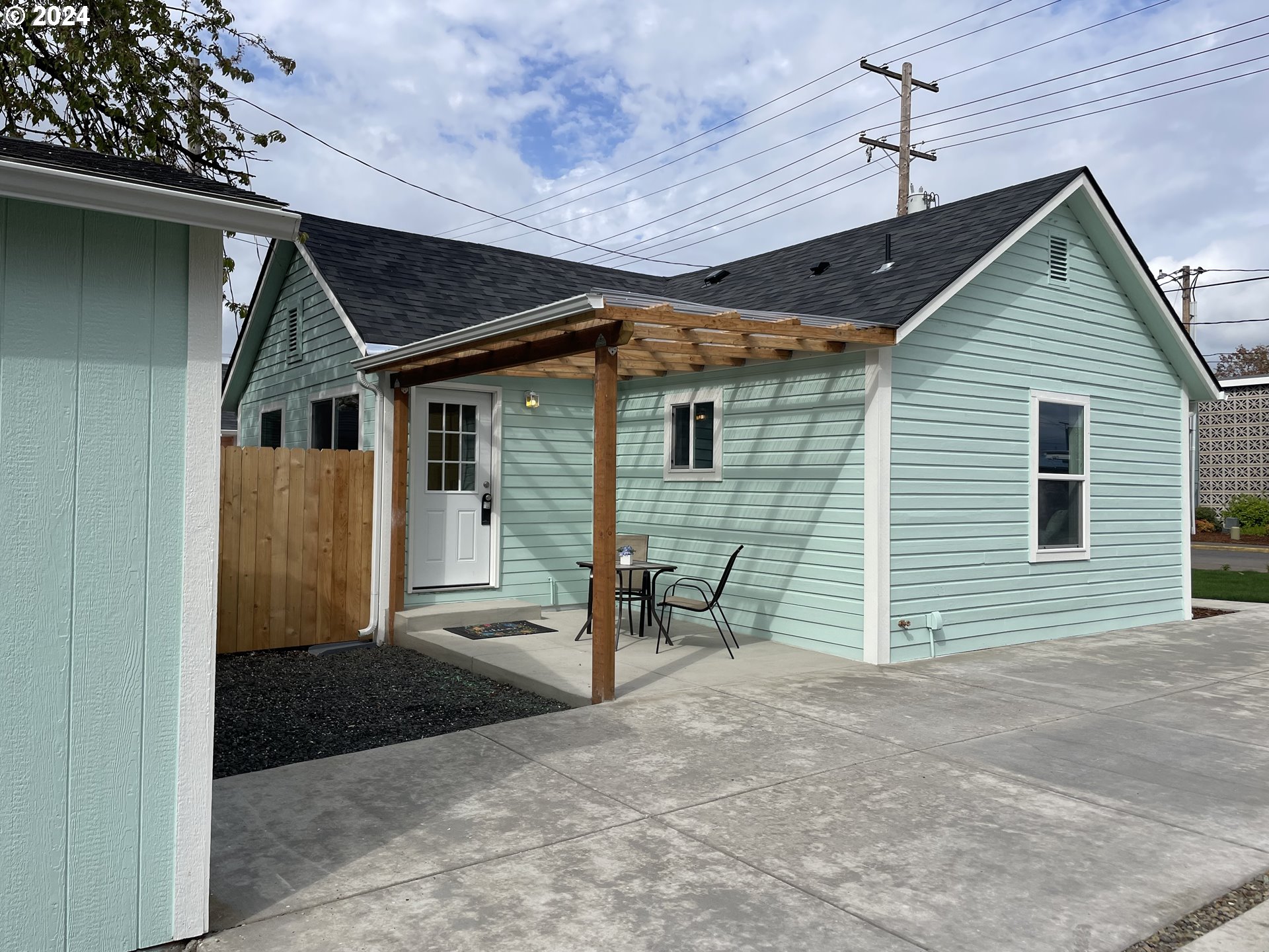 144 South 15th Street Springfield, OR 97477 - Photo 22 of 35 a view of a house with a patio and a yard