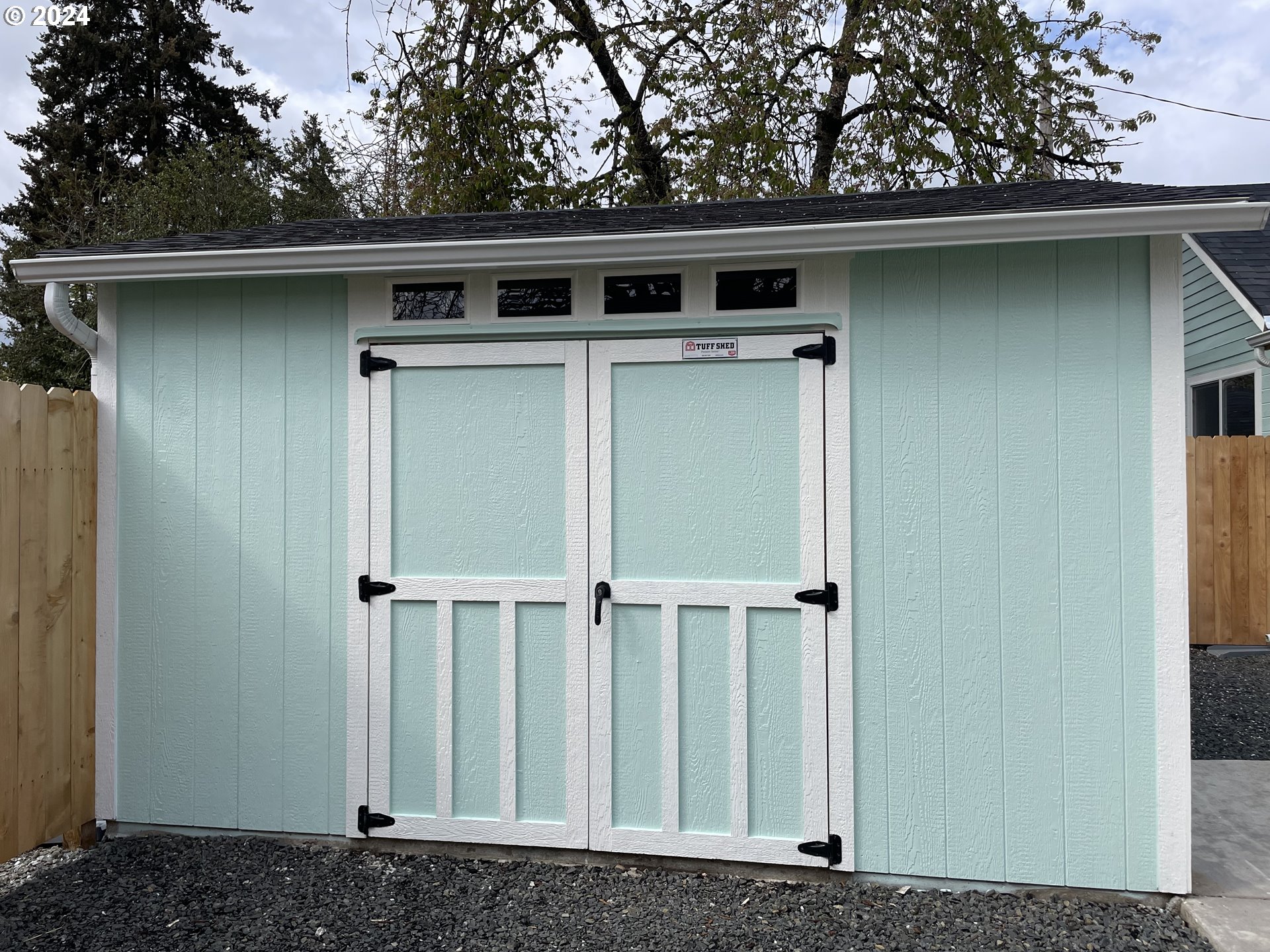 144 South 15th Street Springfield, OR 97477 - Photo 23 of 35 a side view of a house with a wooden fence