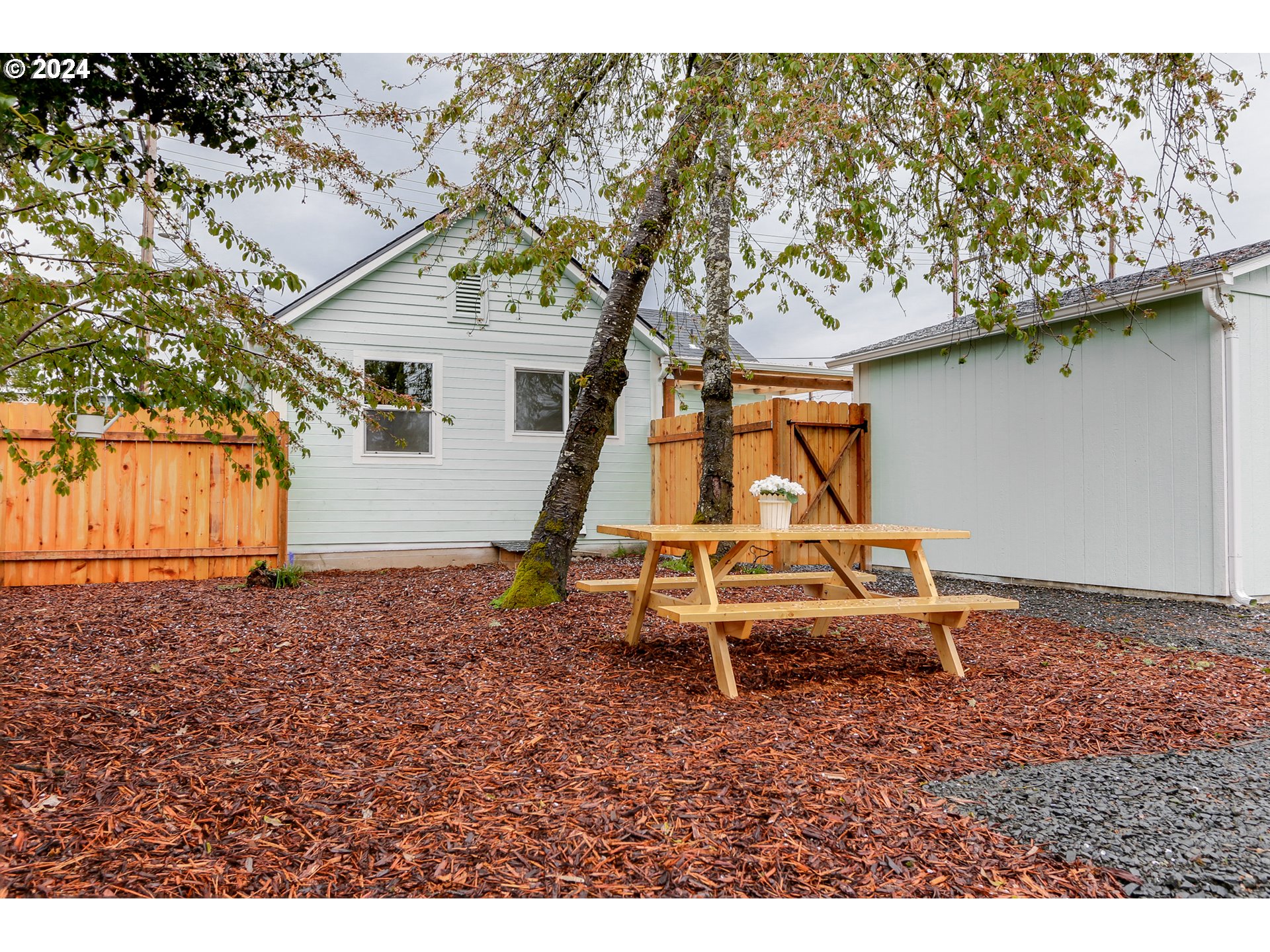 144 South 15th Street Springfield, OR 97477 - Photo 28 of 35 a view of a house with a yard and wooden fence