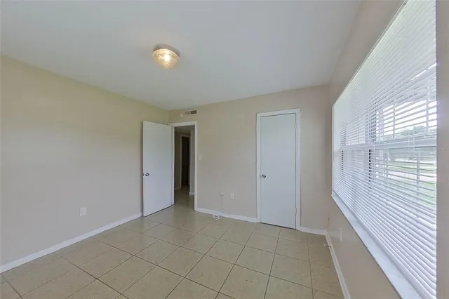 a view of an empty room with a window