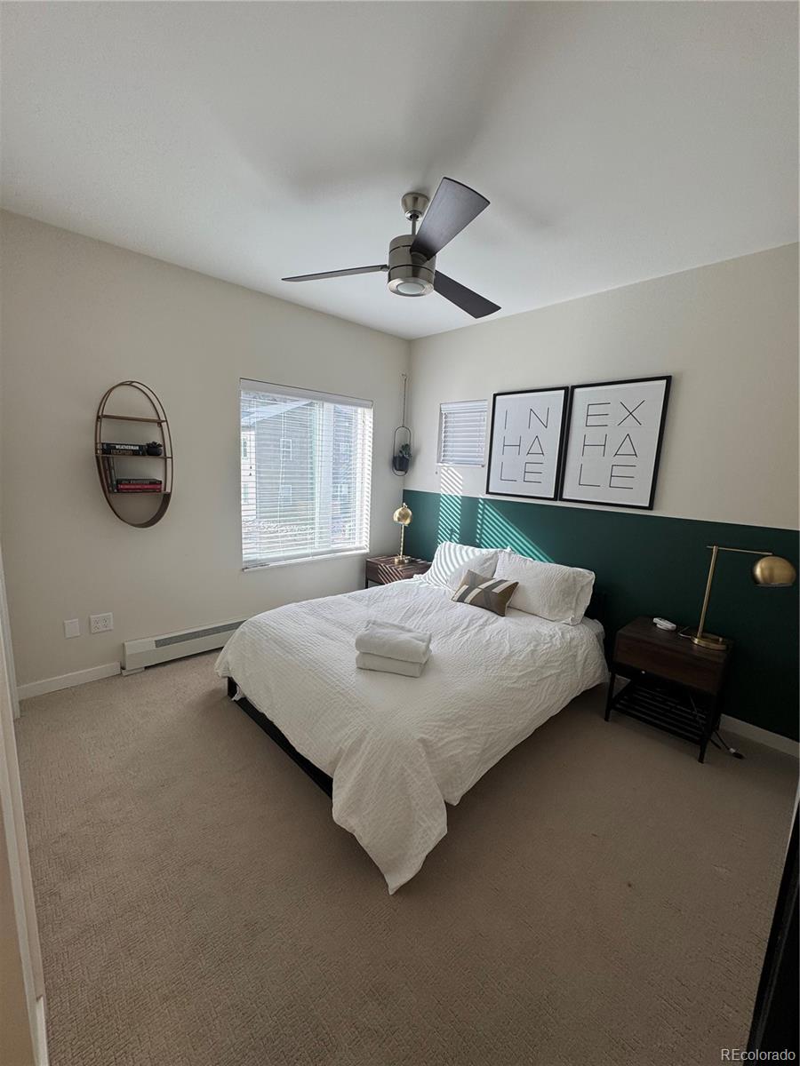 2142 Bighorn Road Georgetown, CO 80444 - Photo 8 of 18 a bedroom with a bed and painting on the wall