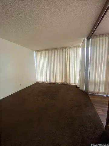 an empty room with a empty space and a window