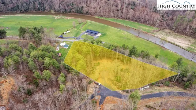a view of a swimming pool with a yard