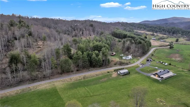 a view of a field with an trees