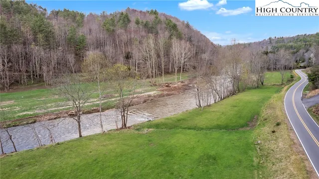 a view of a swimming pool with a yard