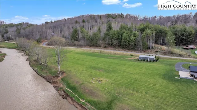 a view of a pathway of a yard with iron fence