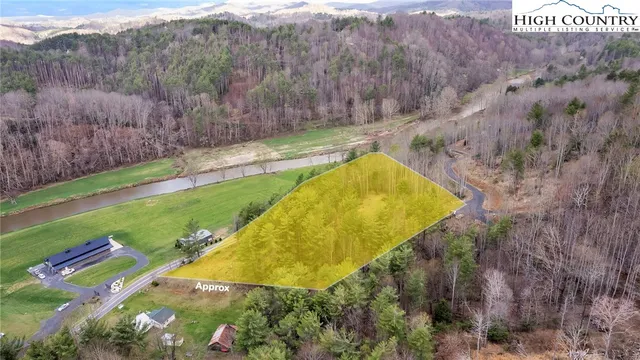 a view of a street with a yard