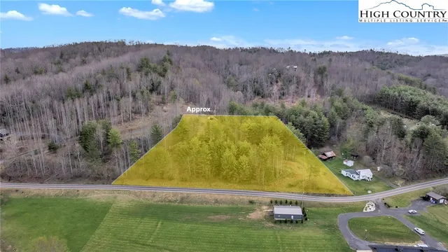 a swimming pool with trees in the background