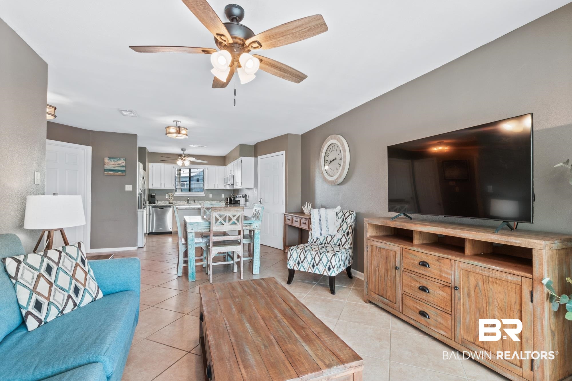 25925 -C Canal Road, Unit 203 Orange Beach, AL 36561 - Photo 19 of 57 Tiled living room with ceiling fan
