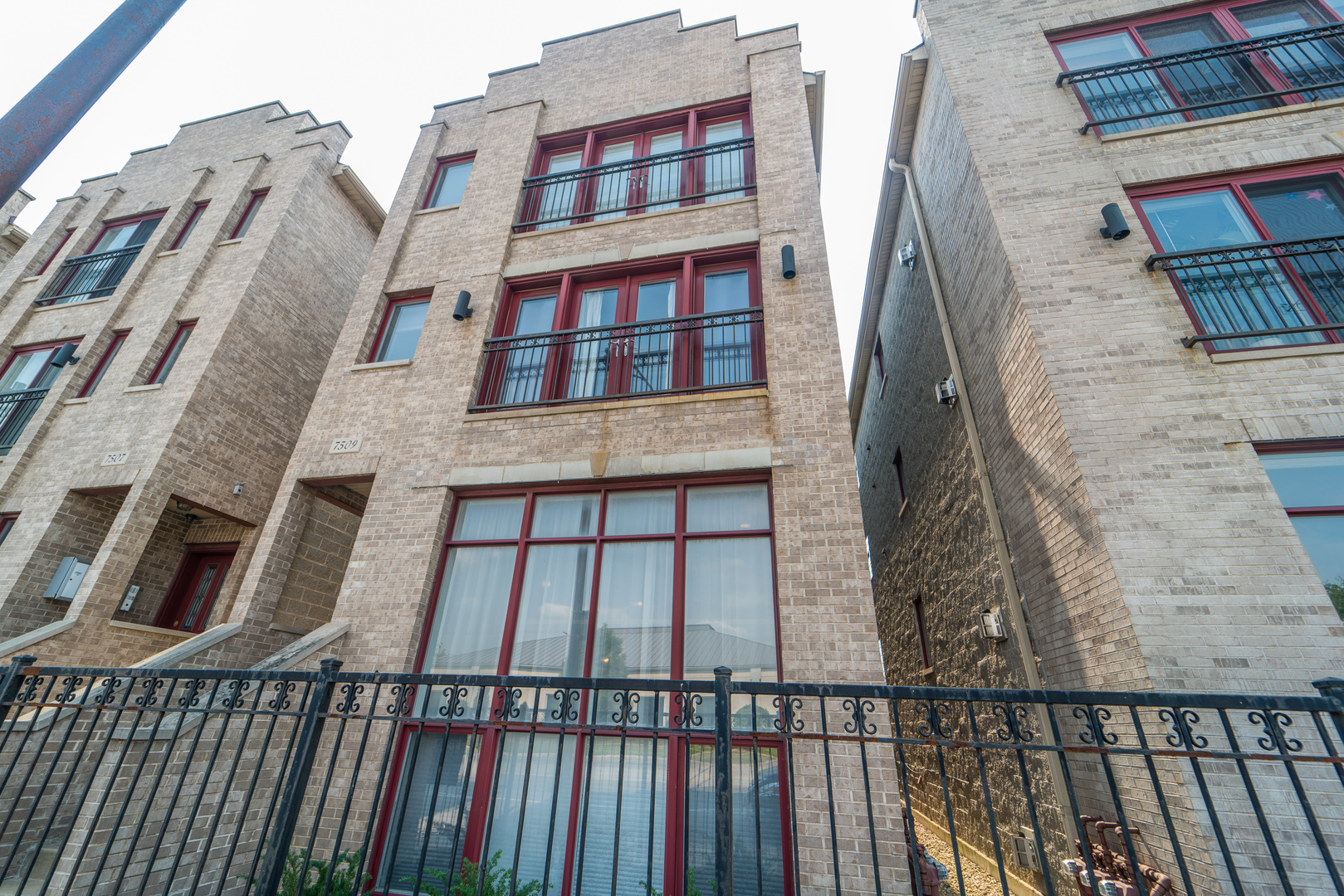 7509 West Irving Park Road, Unit 1 Chicago, IL 60634 - Photo 1 of 28 a balcony view with a large window