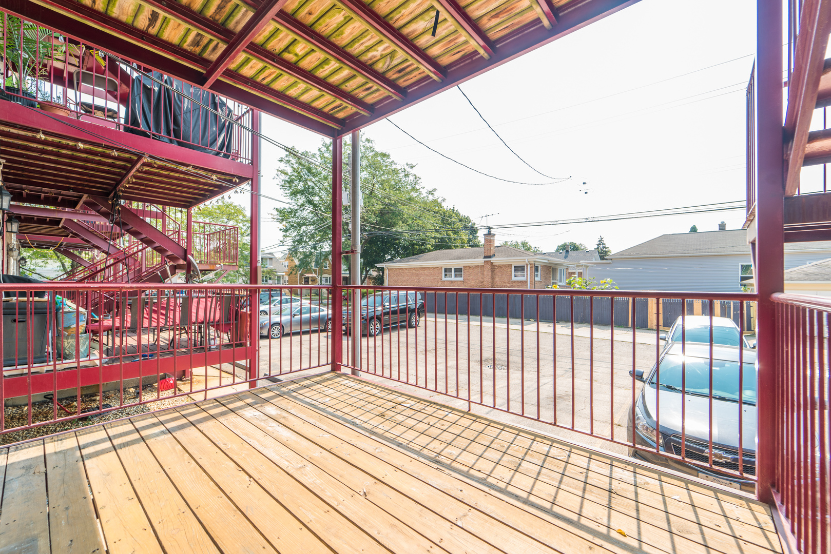 7509 West Irving Park Road, Unit 1 Chicago, IL 60634 - Photo 23 of 28 a view of a balcony with wooden floor