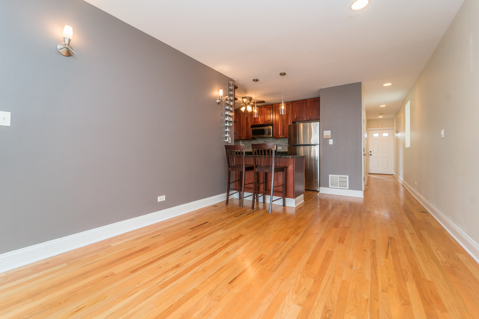 7509 West Irving Park Road, Unit 1 Chicago, IL 60634 - Photo 5 of 28 a view of a room with wooden floor
