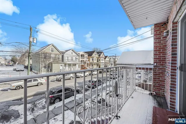 a view of a patio with couches table and chairs and potted plants