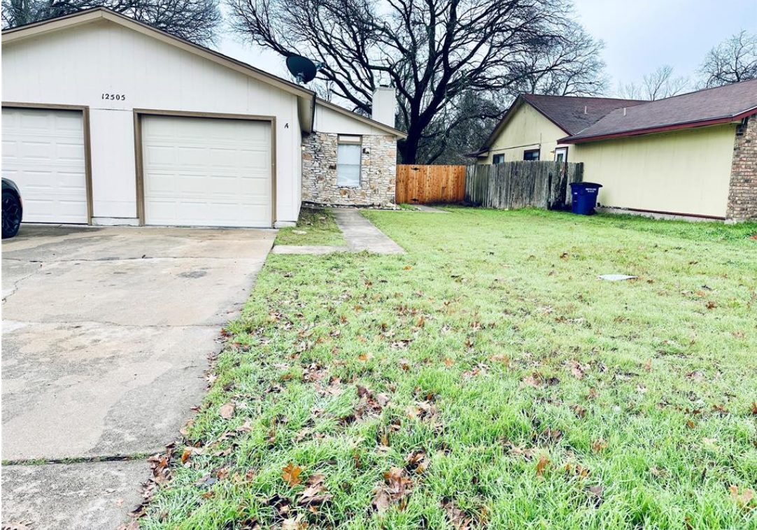 A classic brick and siding home with a generous front yard awaits your personal touch.