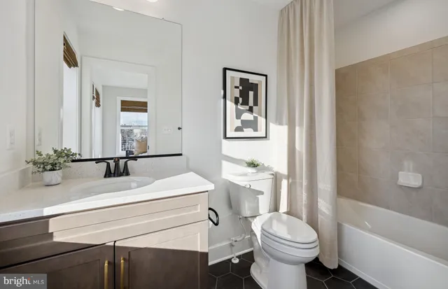 a bathroom with a sink a toilet and a bathtub