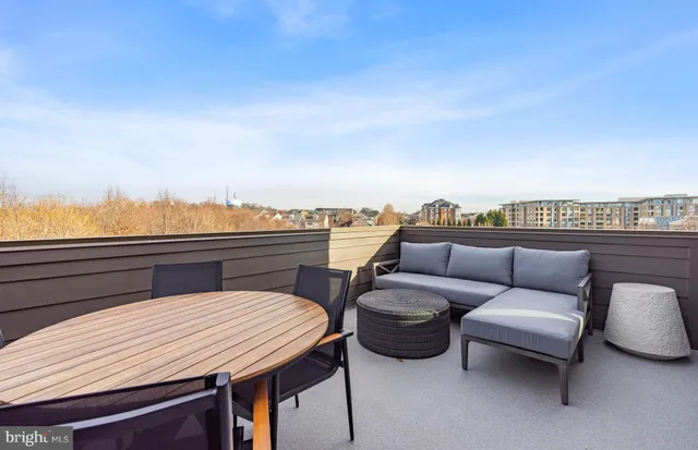 a balcony with furniture and city view