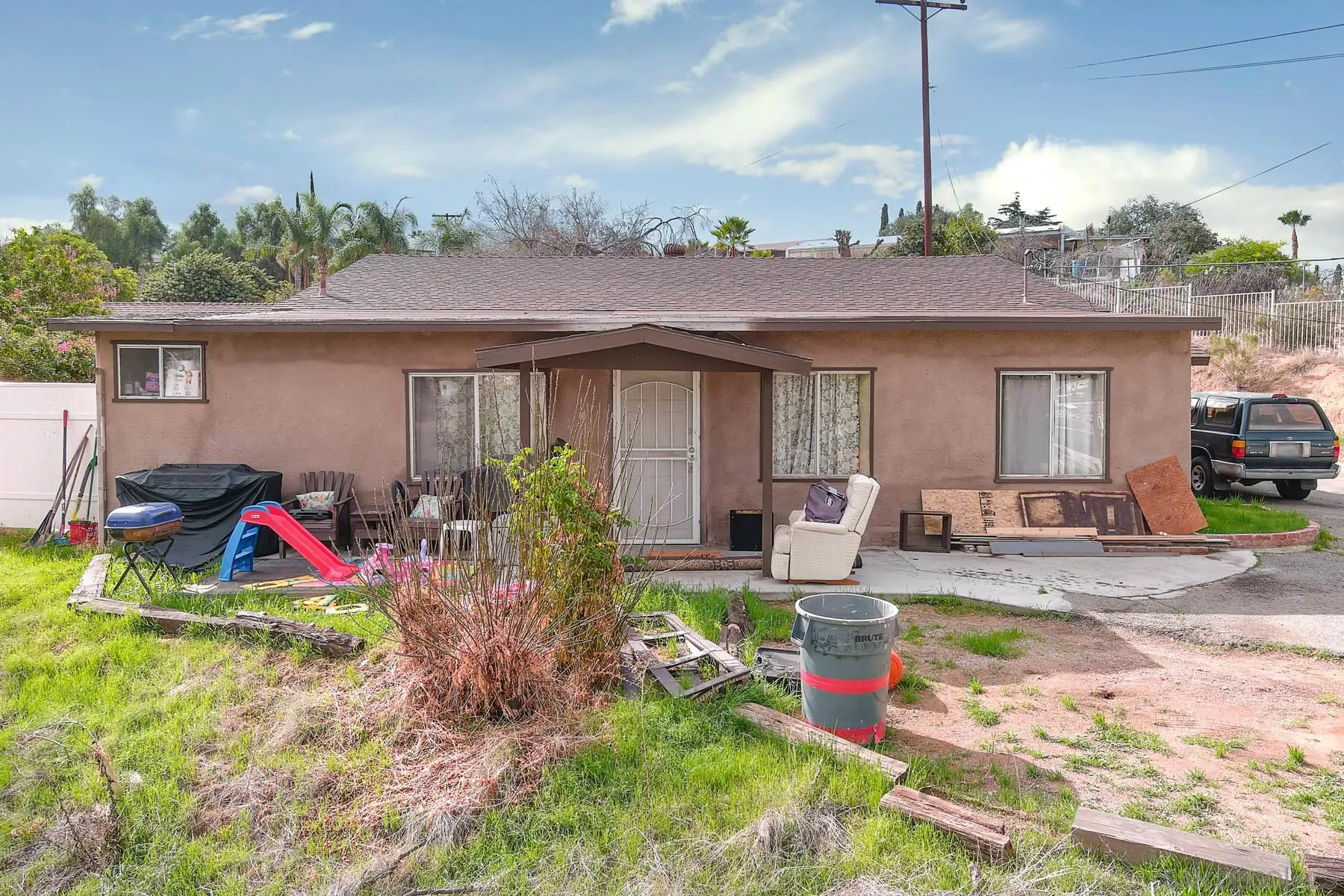 8443 Holsofar Road El Cajon, CA 92021 - Photo 2 of 11 a view of a house with backyard sitting area and swimming pool