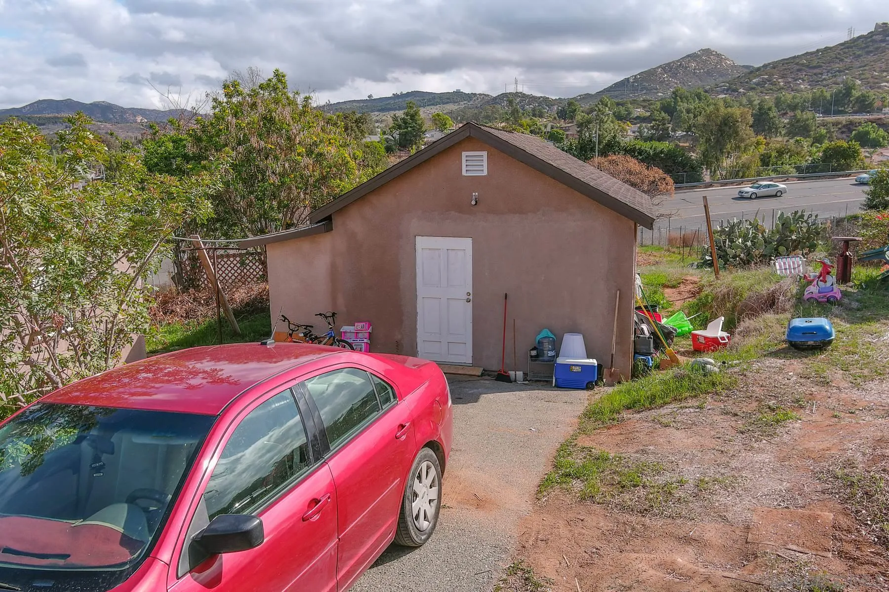 8443 Holsofar Road El Cajon, CA 92021 - Photo 3 of 11 a view of backyard with outdoor seating and green space