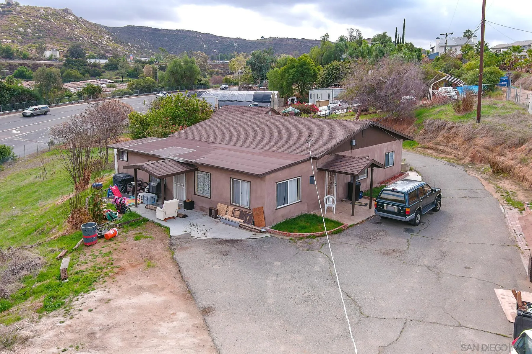 8443 Holsofar Road El Cajon, CA 92021 - Photo 6 of 11 an aerial view of a house with a garden